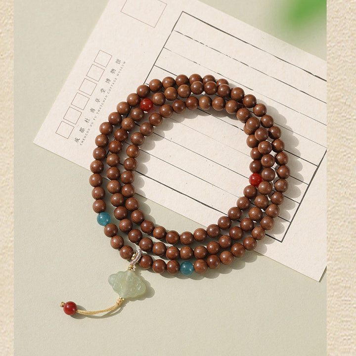 Sandalwood Bracelets - Hetian Nephrite, Beeswax Amber & Tara Pendants.