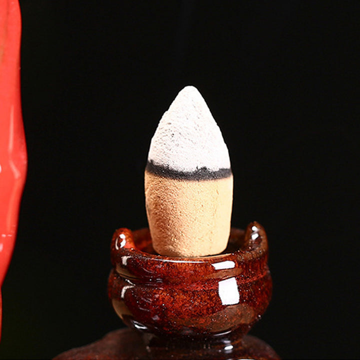 Exquisite Bodhidharma - themed Purple Clay Backflow Incense Burner.