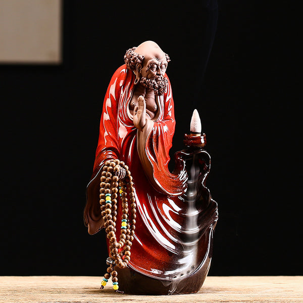 Exquisite Bodhidharma - themed Purple Clay Backflow Incense Burner.