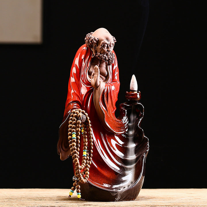 Exquisite Bodhidharma - themed Purple Clay Backflow Incense Burner.